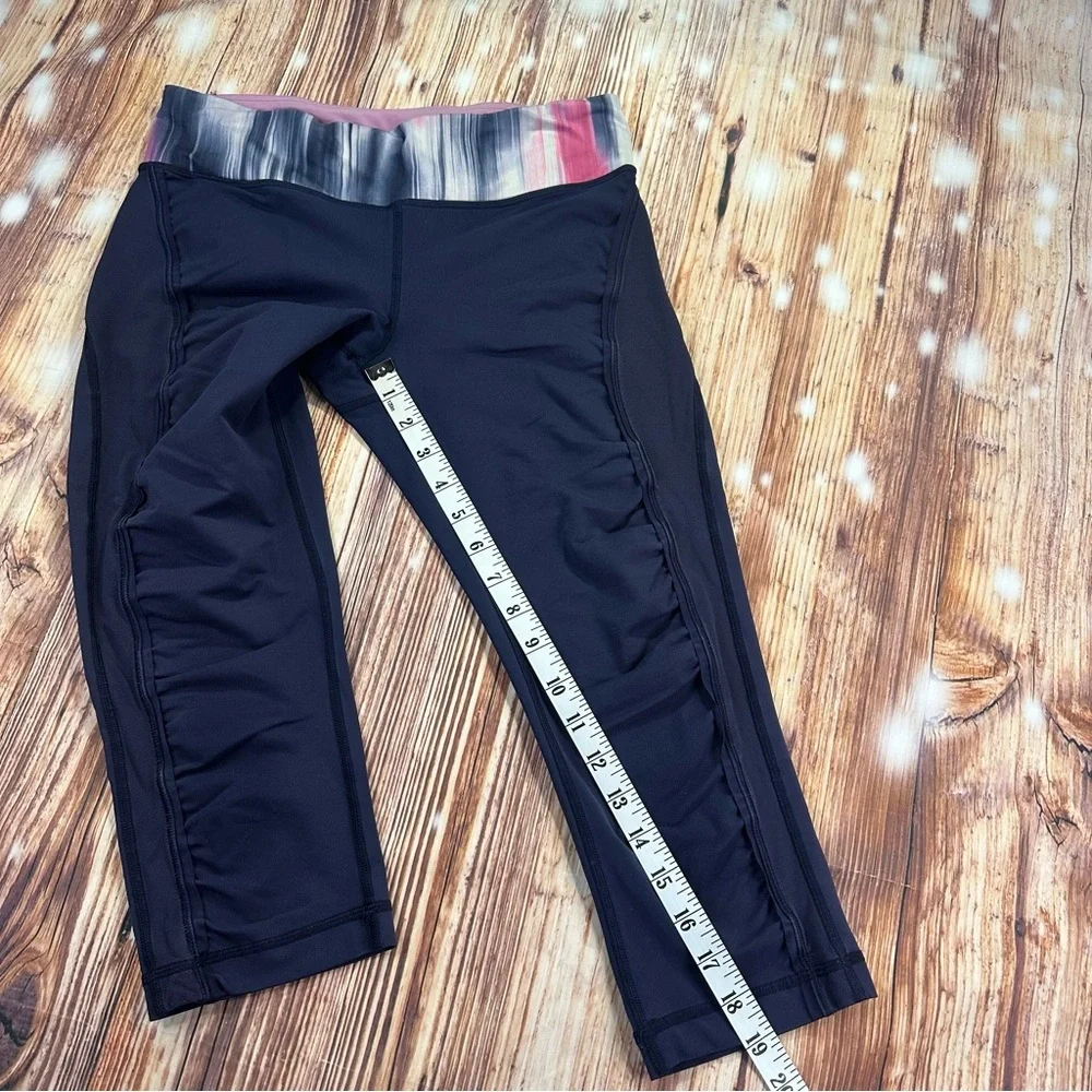 Lululemon Dark Navy ,colorful waist ban and slightly cropped leggings Size 8.